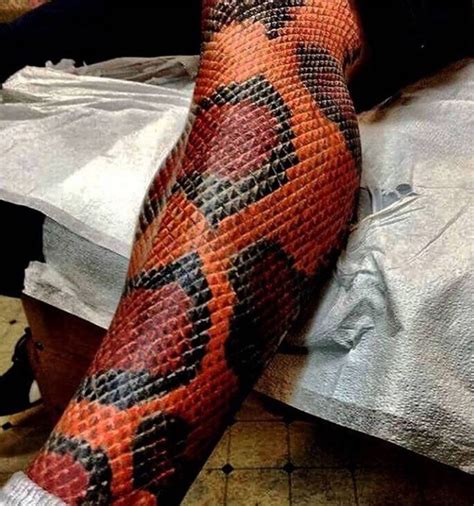 12 sept. . Snake wrapping around leg tattoo